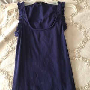 Purple sleeveless ruffle detail top.
